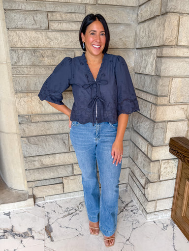 navy embroidered top
Tie front blouse
ruffle trip embroidered top