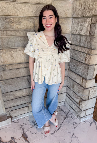 Ivory bubble sleeve top with flowers
button front v neck blouse with ruffle shoulder