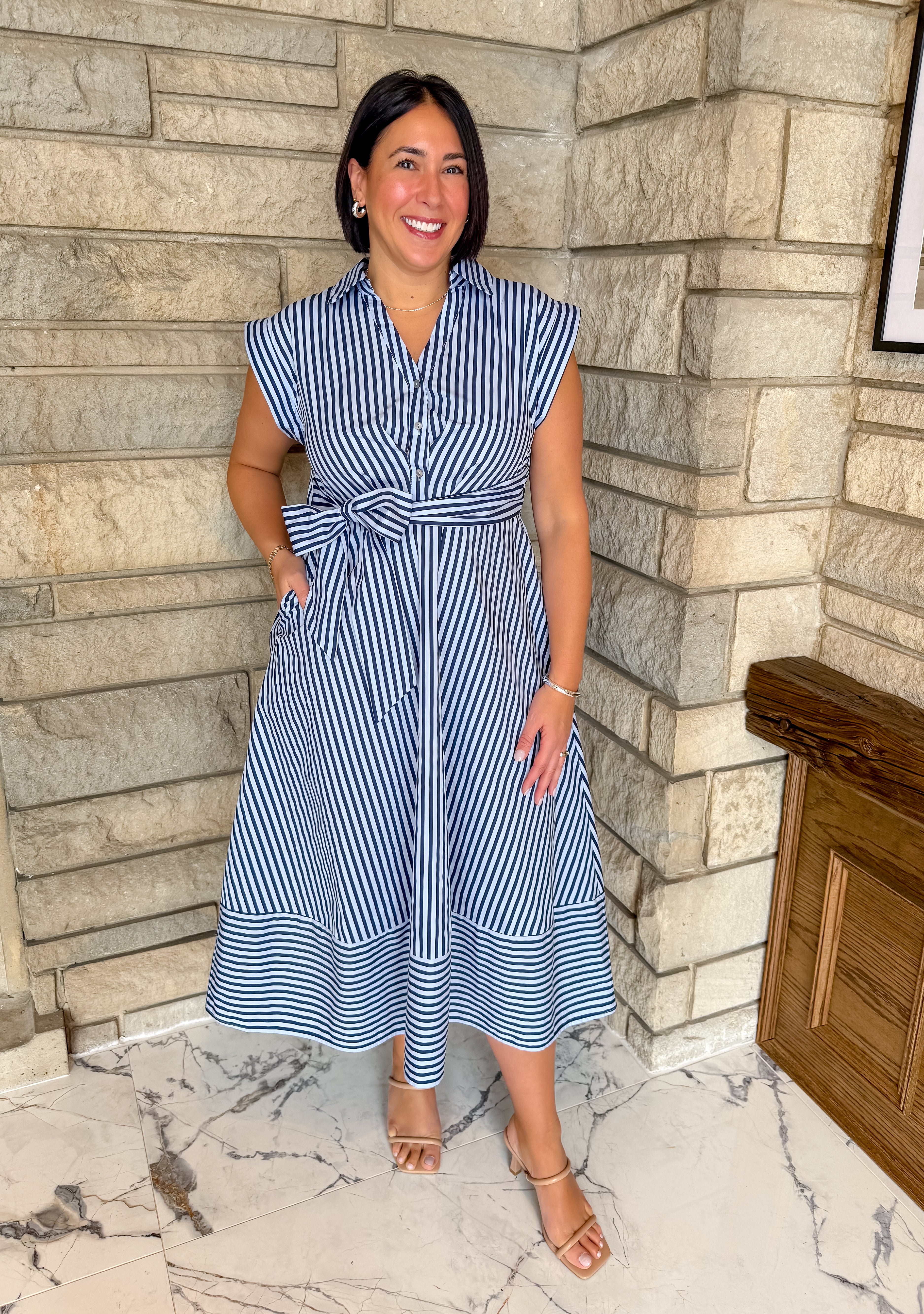 Navy and light blue striped midi dress. Buttons with collar and self tie waist belt. 