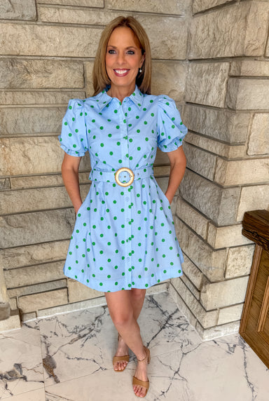Light blue dress with kelly green polka dots. Button front shirt dress with puff sleeves. Belted polka dot dress with belt.