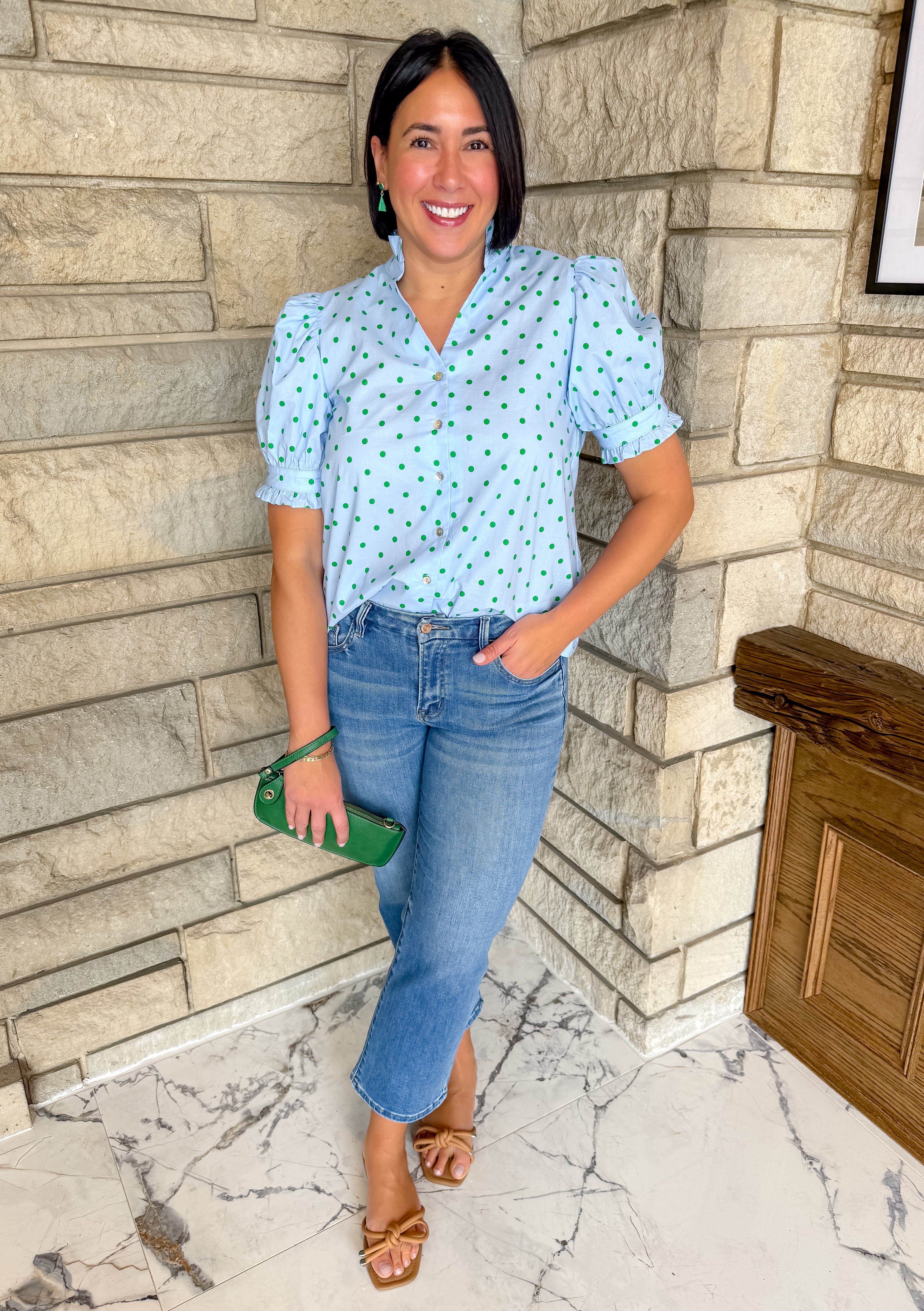 Light blue top with kelly green polka dots. Button front top with short puff sleeves.