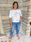 White bubble sleeve top
Blue embroidered flowers
elastic banded hem