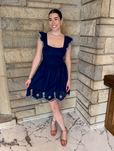 navy dress white embroidered details square neckline 