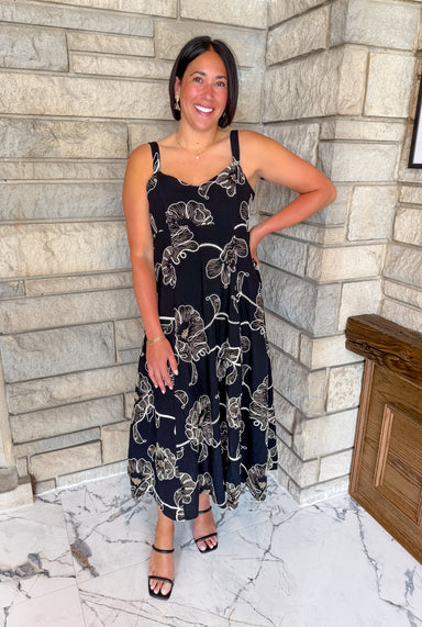 Black dress with light brown and ivory flowers
embroidered midi dress