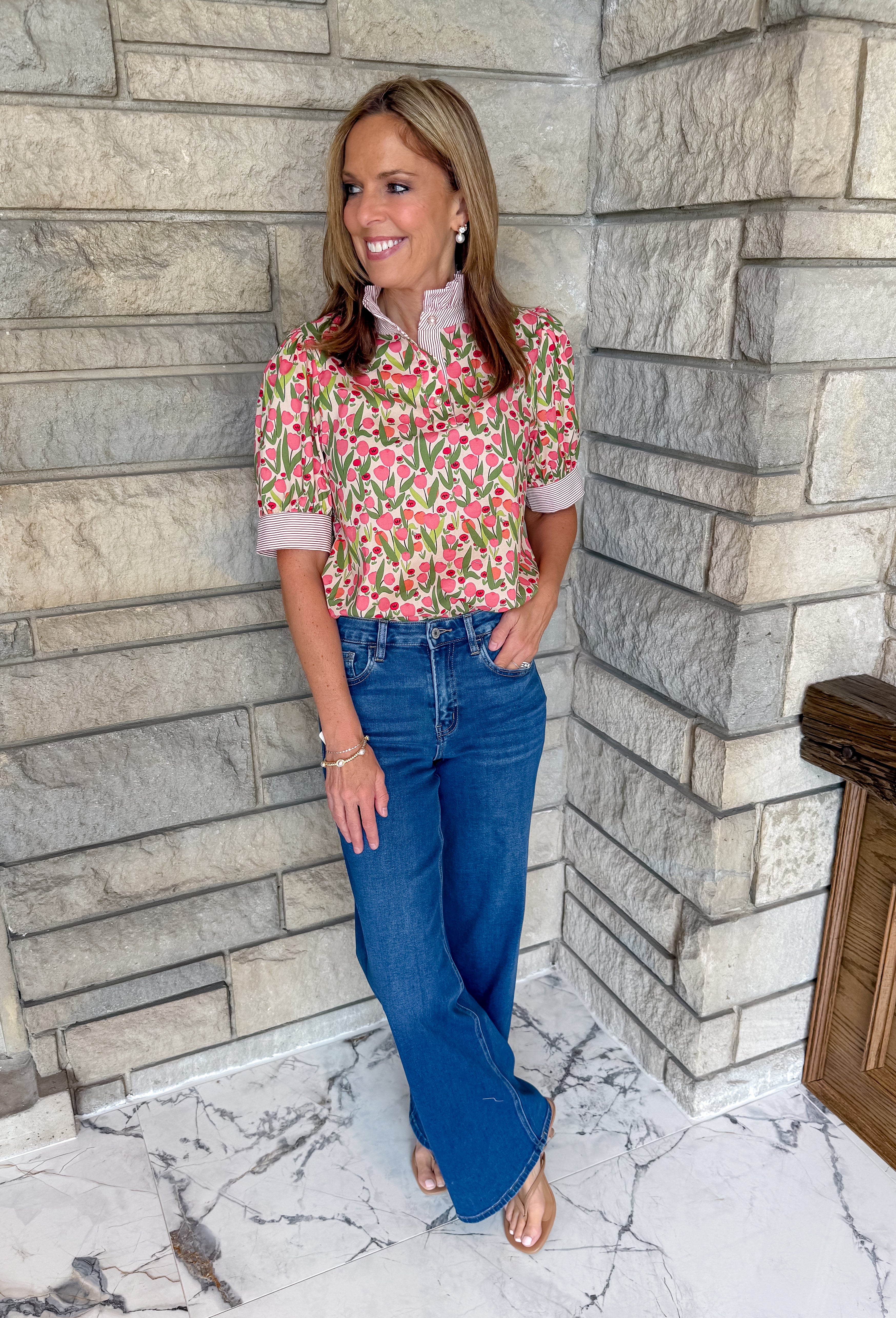 Mixed print top 
ruffle neckline
pearl buttons
contrast trim neck and cuffs