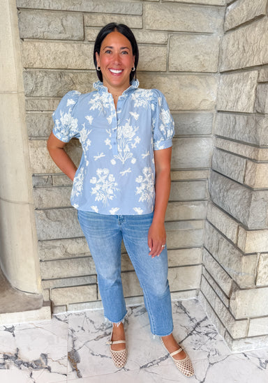 light blue blouse with cream embroidery
button top with ruffle collar