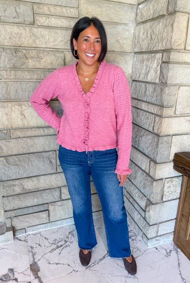 Bright pink cardigan with ruffle edges 