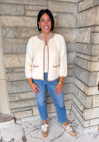 Cream with taupe trim mock neck open cardigan gold closure at neck patch pockets bracelet sleeve length