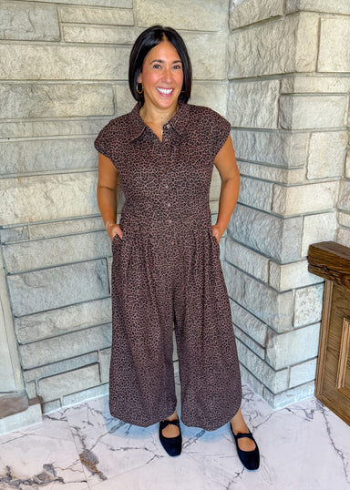Brown with black mini leopard print jumpsuit with buttons and collar and wide legs and side cinched details