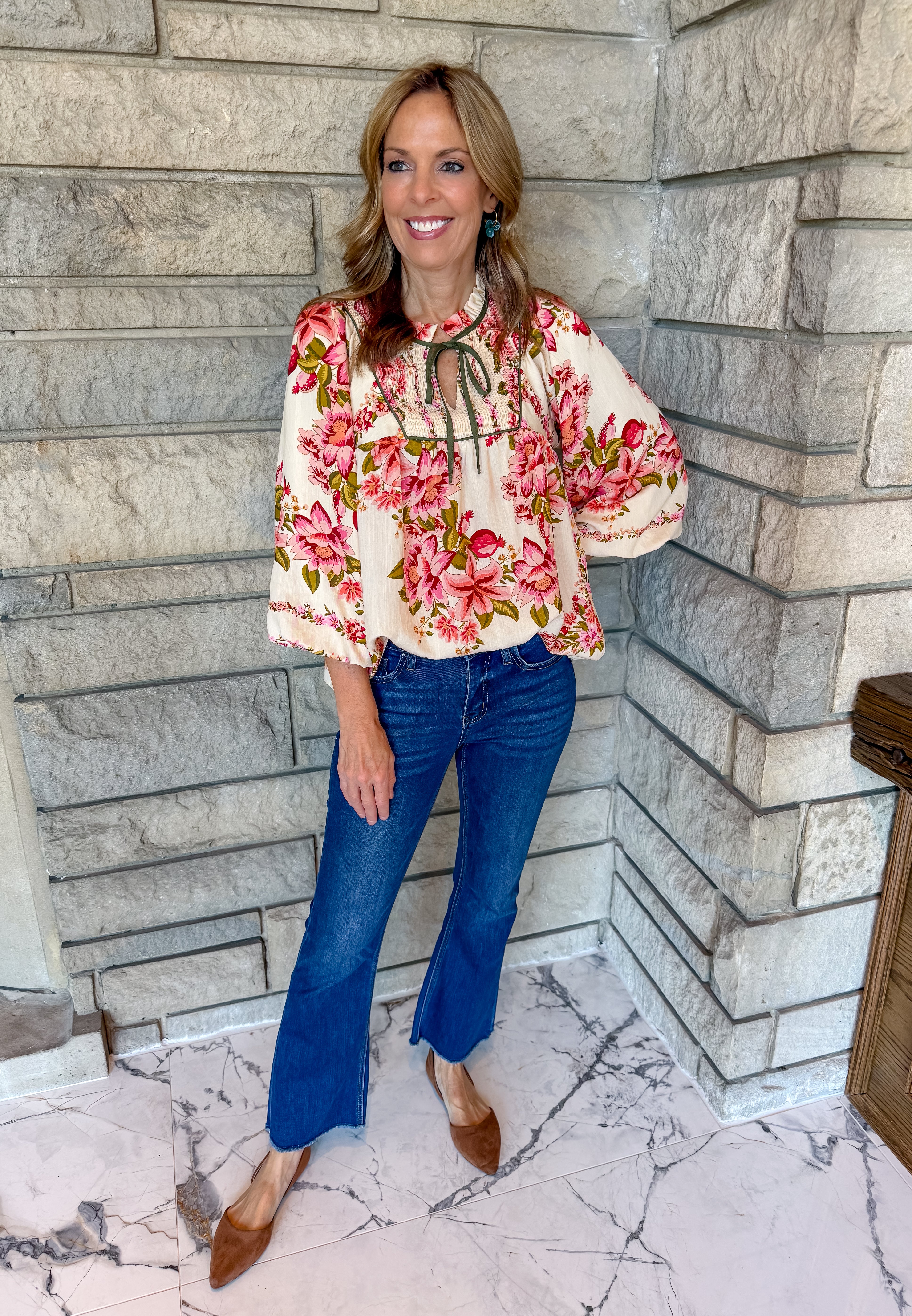 oatmeal with pink and green floral print boho style top, 3/4 balloon sleeves, olive green trim on chest and mini ruffle neck with self tie, loose fit