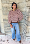 brown and light pink striped top, angled stripes at shoulder, long puff balloon sleeves, banded cuff, neckline and hem