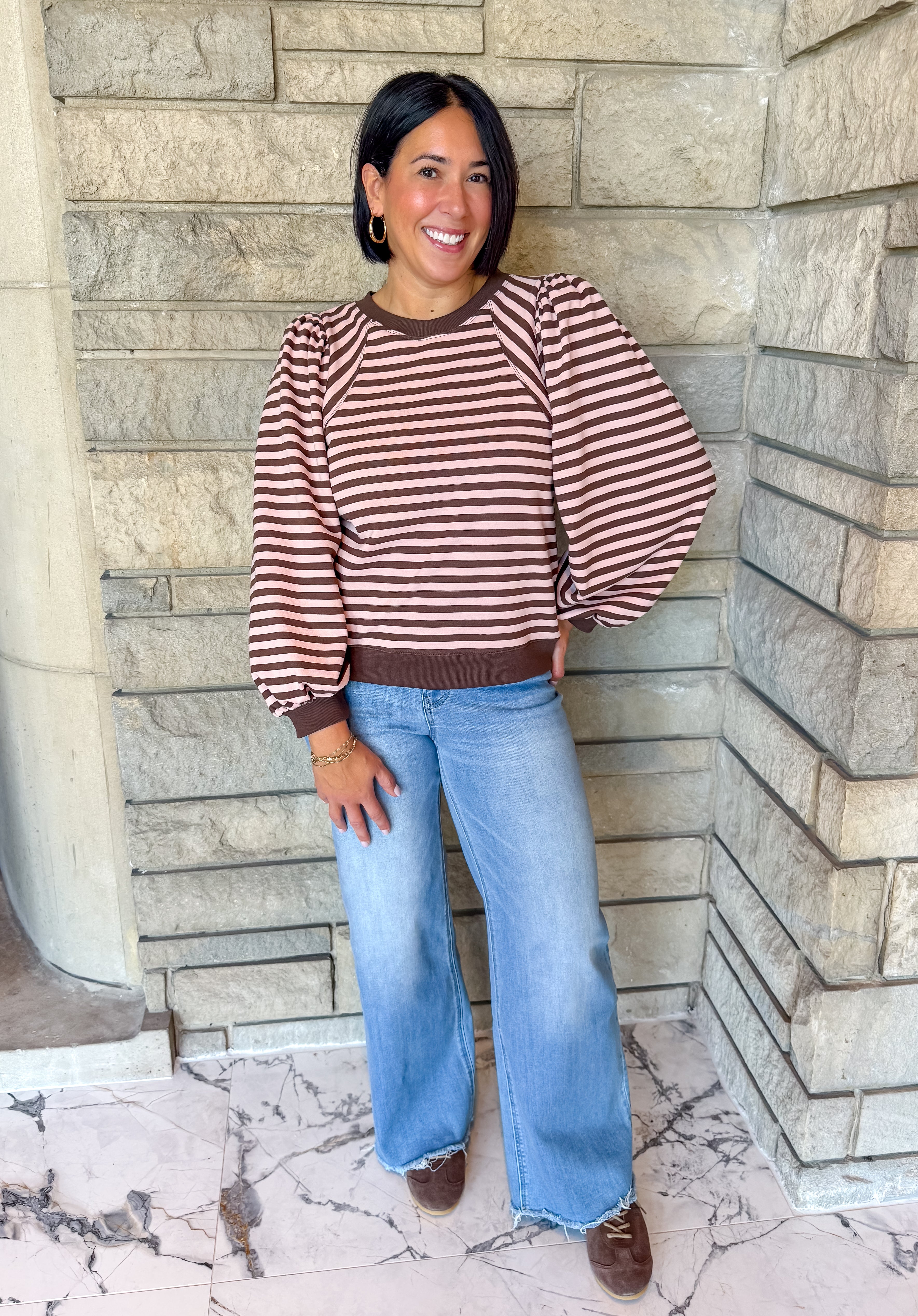 brown and light pink striped top, angled stripes at shoulder, long puff balloon sleeves, banded cuff, neckline and hem