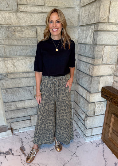 washed wide leg olive cotton pants with leopard print ankle length, elastic waistband and drawstring, pockets