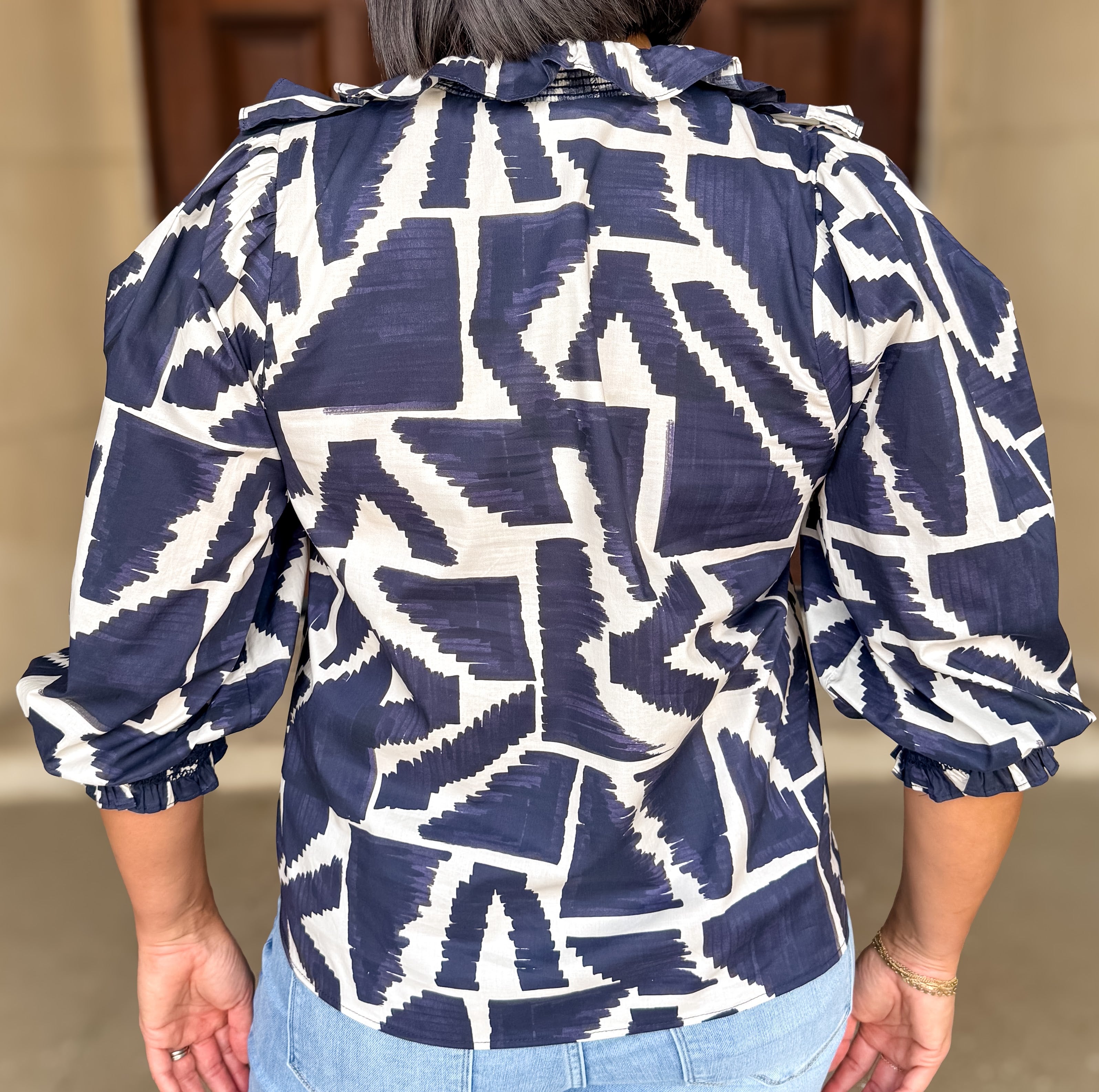 Becca Printed Smocked Ruffle Top