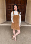 Corduroy
Overall Dress
Adjustable Straps
Front Patch Pockets
Split Seam Detail
Camel