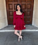 Satin Dress
Square Neckline
Long Puff Sleeves
Elastic Cuffs
Ruffle Tier Skirt
Smocked Back
Waistband Detail
Lined
Burgundy