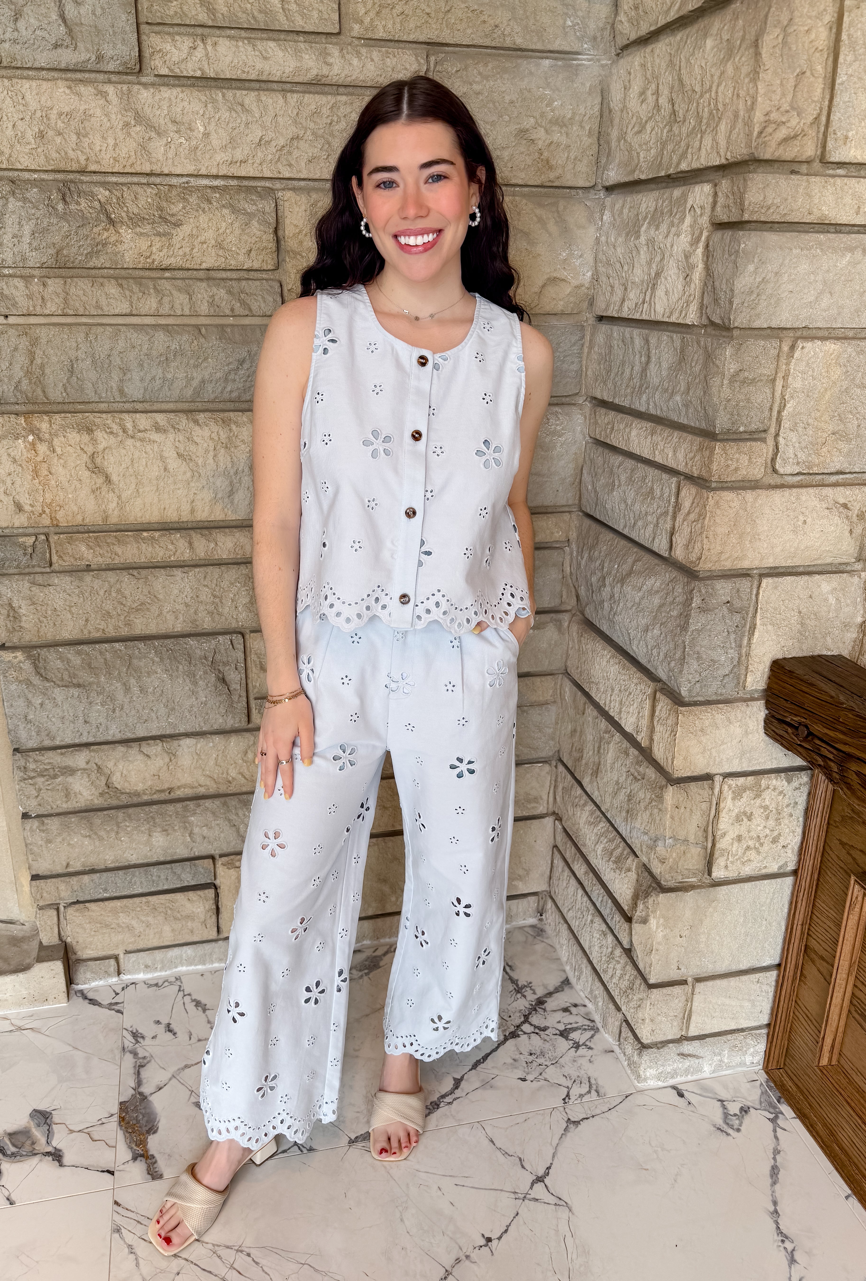 Eyelet sleeveless button top and wide leg pants set. 