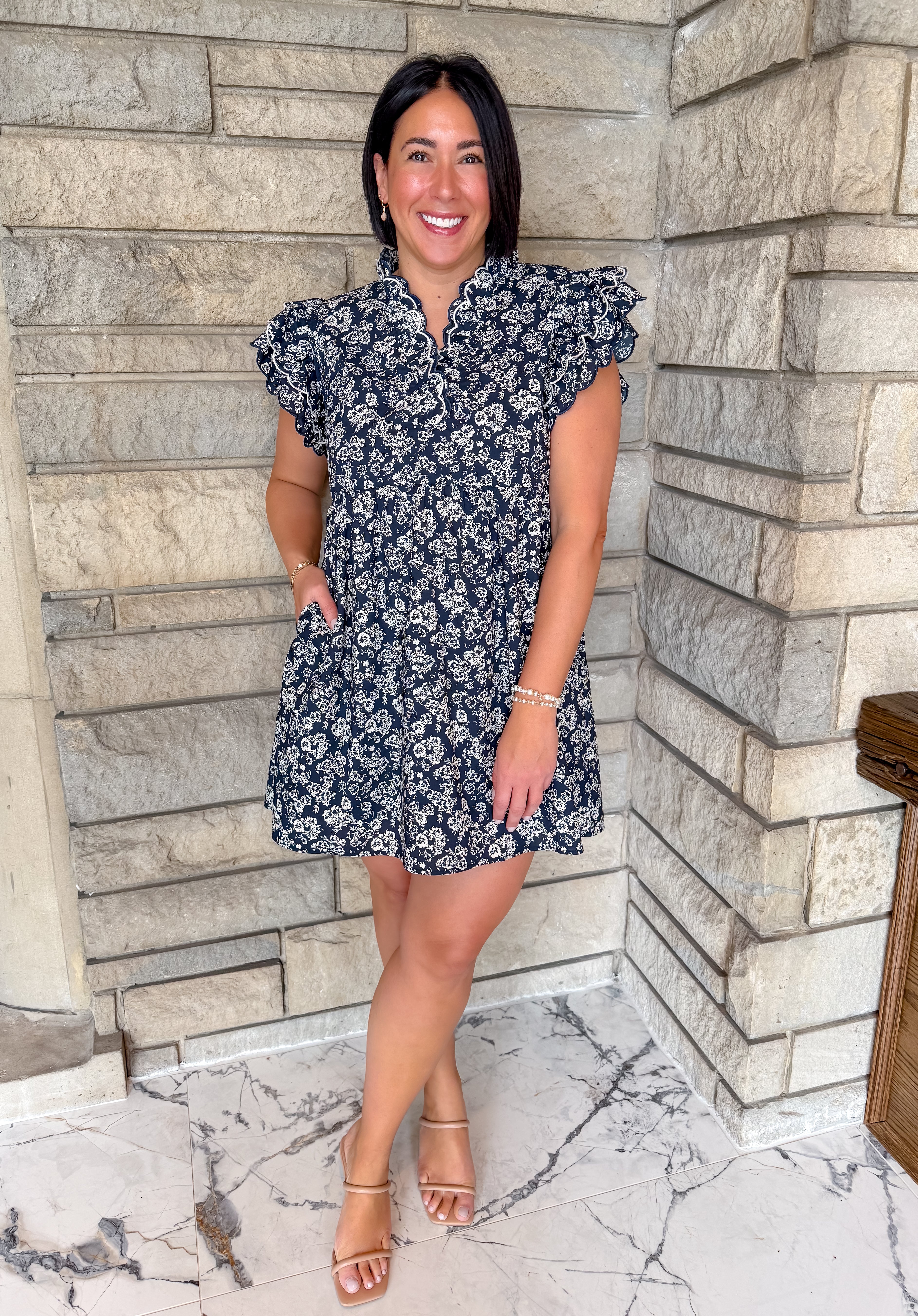 Navy dress with natural color flower print and ruffles