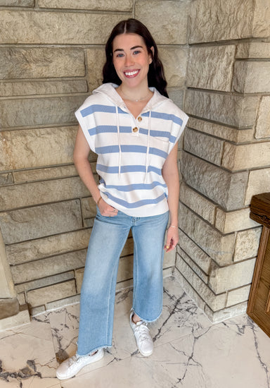 Striped button front sleeveless hoodie with front pocket.