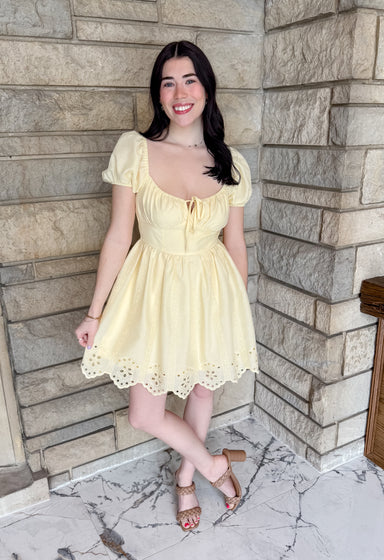 butter yellow scoop neck dress
eyelet scallop hemline
short puff sleeves
tie front