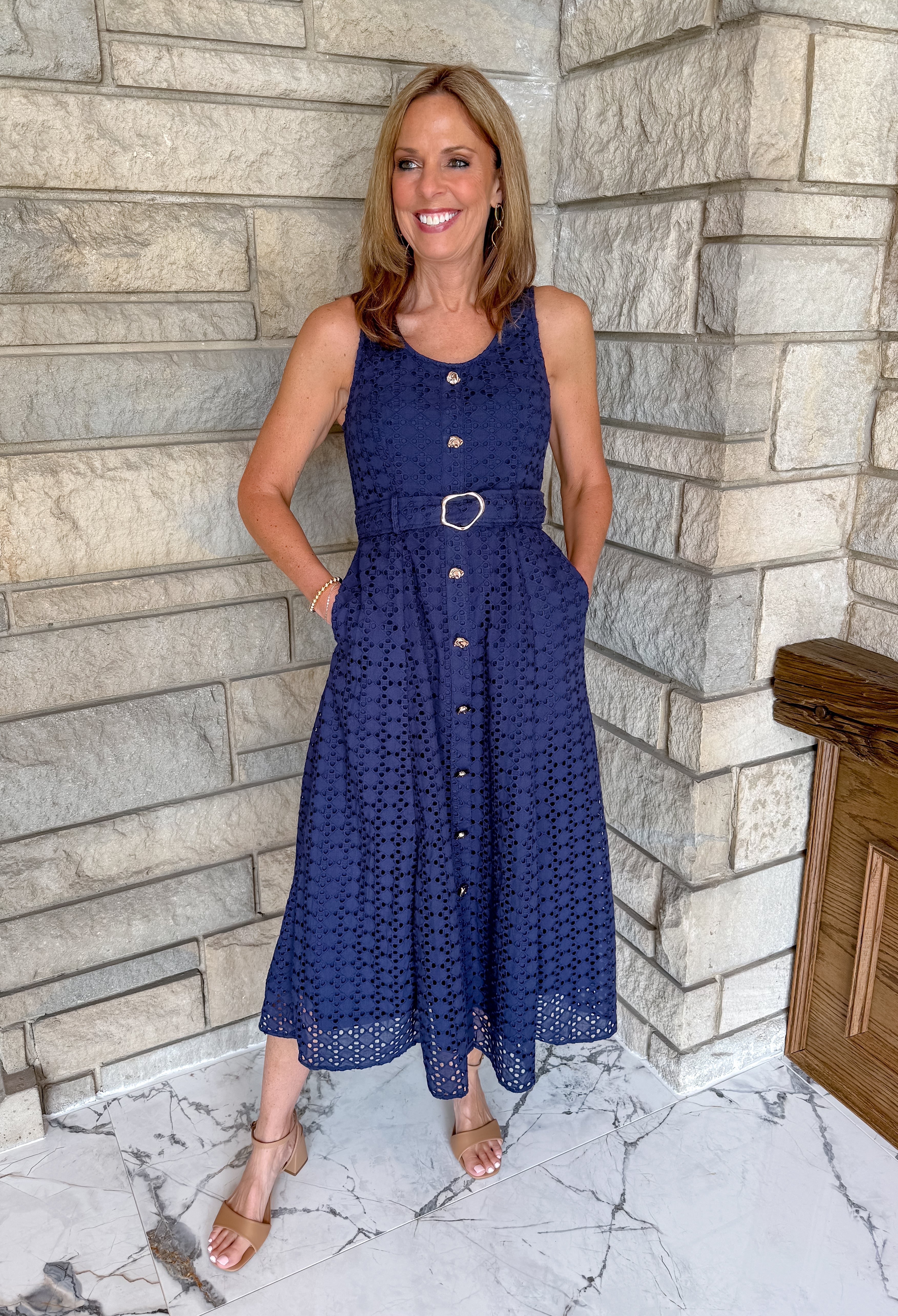 navy eyelet belted midi dress
navy dress with gold buttons