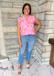 light pink sleeveless top with coral and white flowers
ruffle sleeves and neck sleeveless flower top