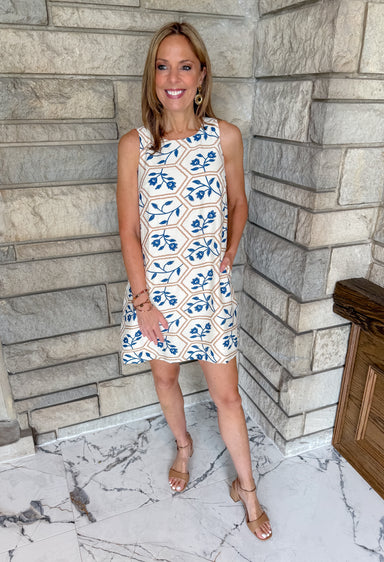 Natural dress with blue flowers and brown print
sleeveless short dress