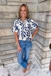 Cream with navy leaf print
button top with collar
bubble sleeves