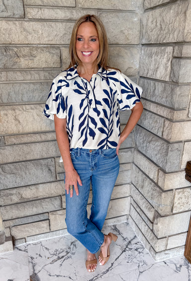 Cream with navy leaf print
button top with collar
bubble sleeves
