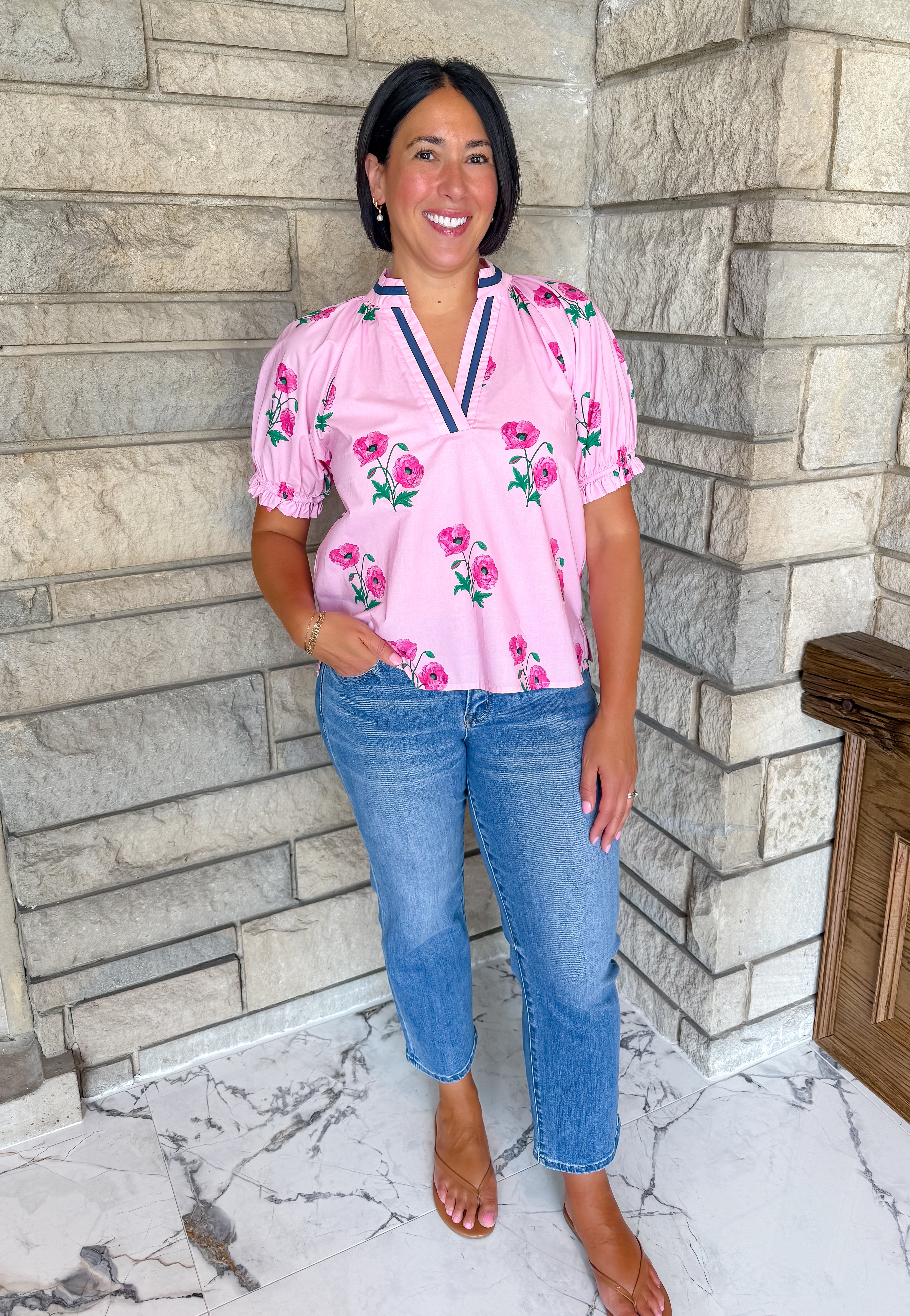light pink top with flower print navy lue trim 