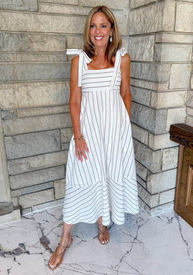 White dress with brown stripes tie straps maxi