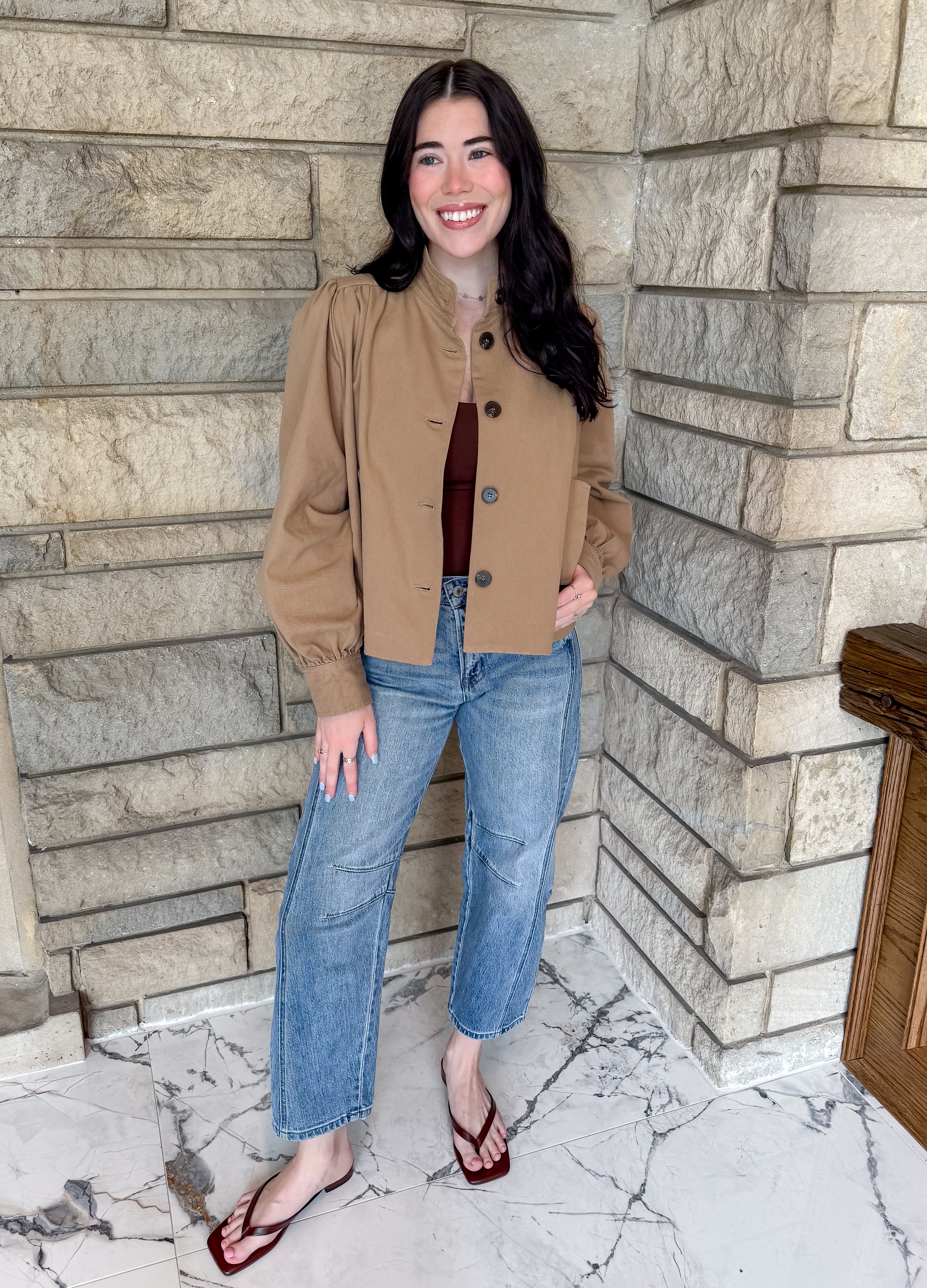 camel short swing coat with brown buttons and stand collar