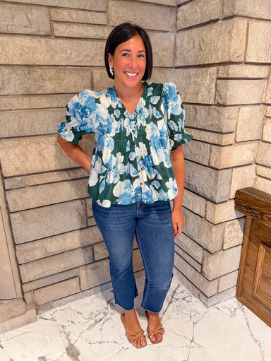 pine green top with light blue and off white watercolor floral print pintucking buttons puff sleeves ruff cuff