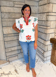 white top with red large flower print smocked ruffle sleeves