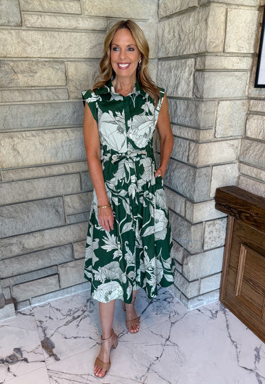 dark green dress with off white large floral print sleeveless buttons collar tie waist with grommets midi